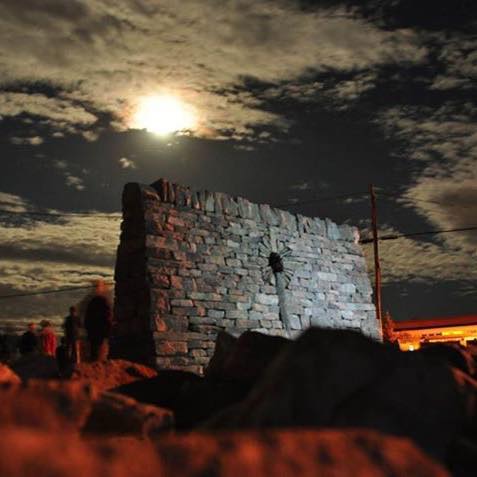 Celtic Cross at night in a wall constructed during the 2015 International Irish-Canadian Dry Stone Festival opposite the Island school on lands owned by Eloise and Dayle Gowan